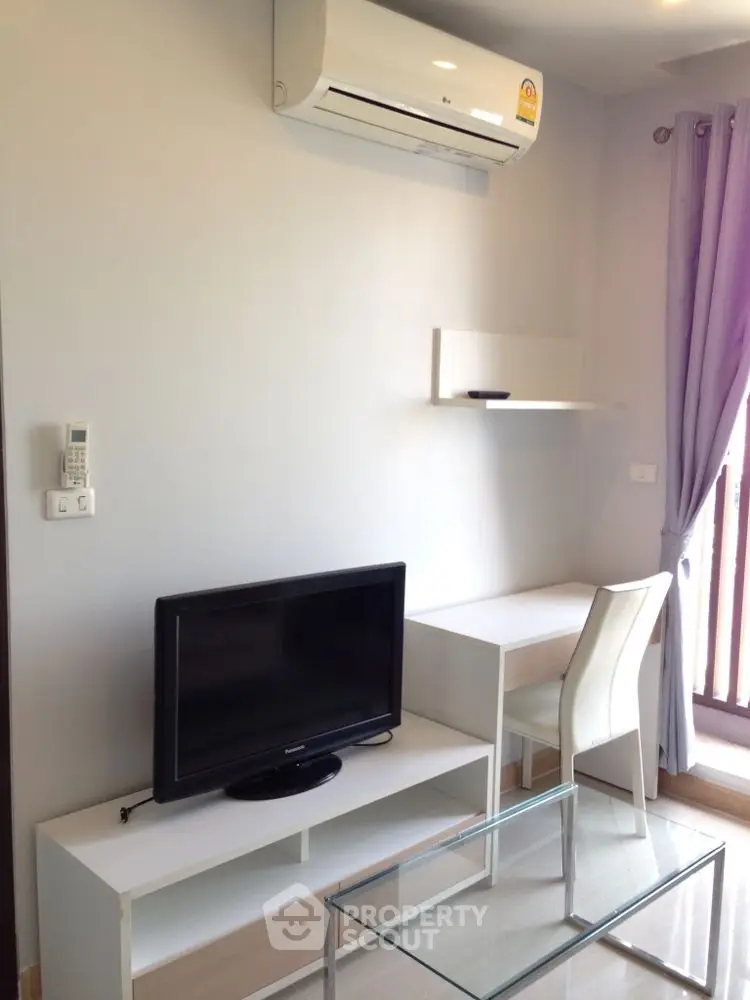 Modern living room with air conditioning and sleek furniture