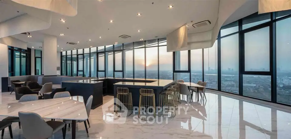 Luxurious high-rise living room with panoramic city views and modern furnishings.