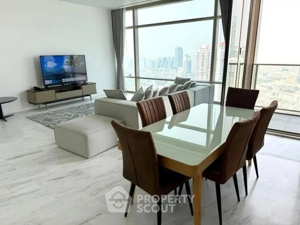 Luxurious high-rise living room with stunning city view and modern furnishings.