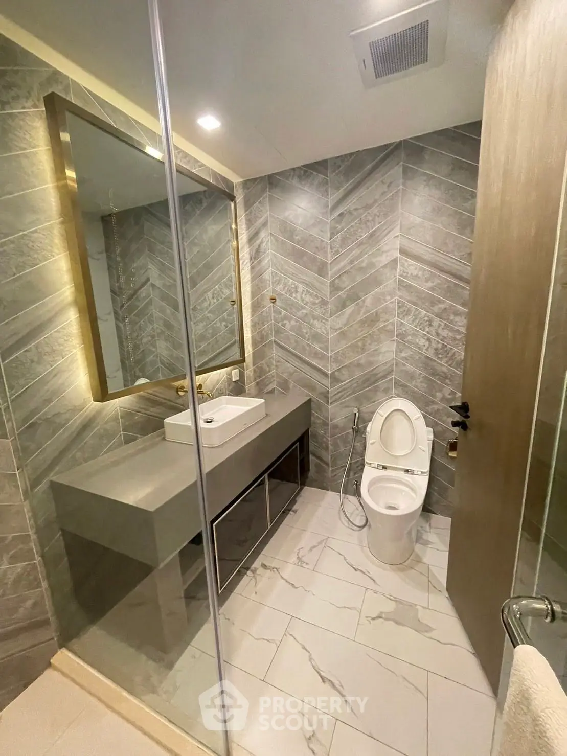 Luxurious modern bathroom with elegant tile design and sleek fixtures.