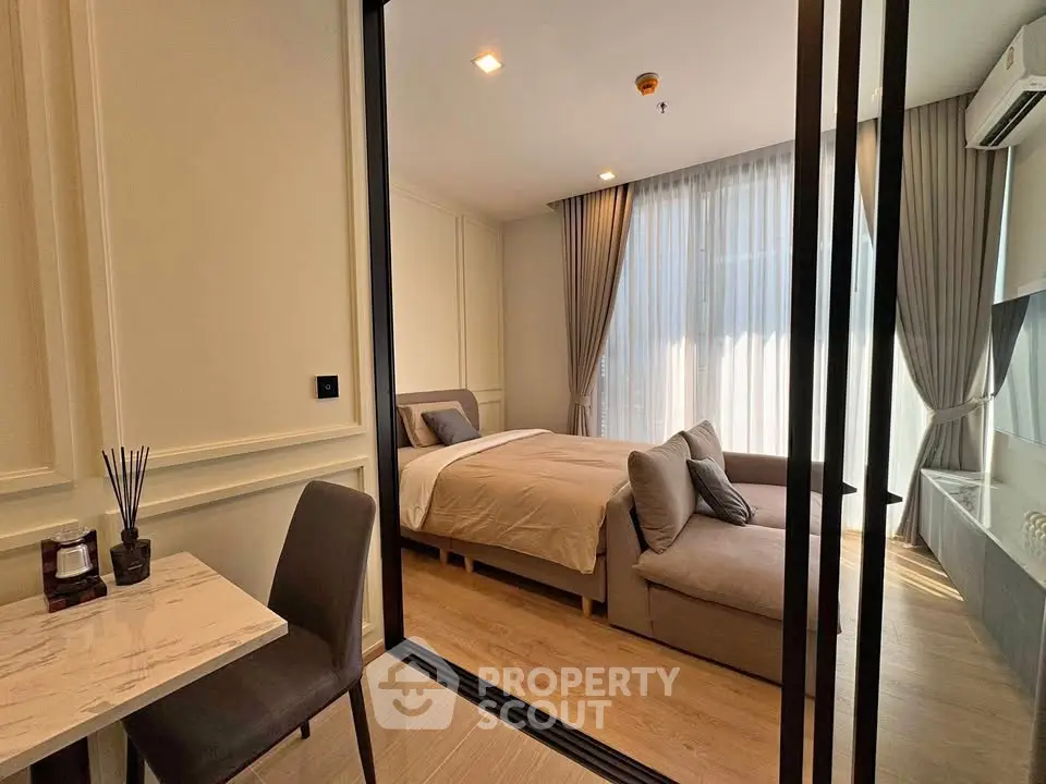 Modern bedroom with elegant decor and cozy ambiance in a luxury apartment
