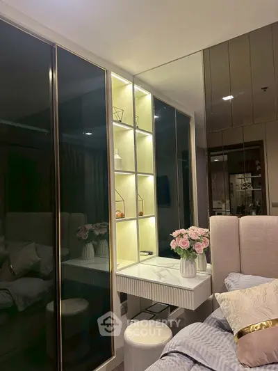 Luxurious bedroom with elegant decor and illuminated shelving