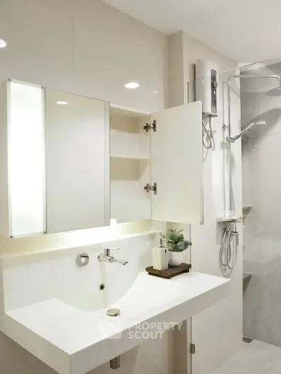 Modern bathroom with sleek fixtures and a spacious shower area.