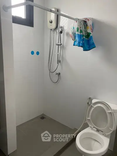 Modern bathroom with shower and toilet in minimalist design