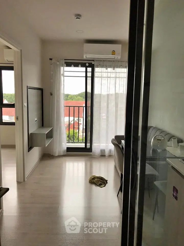 Modern apartment interior with balcony view and natural light