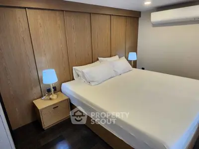 Cozy modern bedroom with wooden accents and ambient lighting