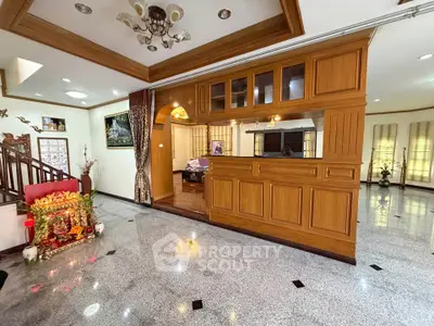 Spacious living room with elegant wooden decor and open layout