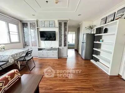 Spacious living room with modern decor and wooden flooring