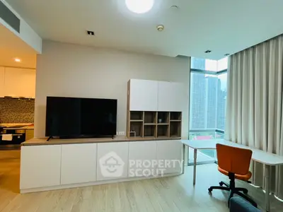 Modern living room with sleek furniture and city view, perfect for urban living.