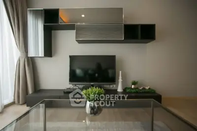 Modern living room with sleek TV unit and stylish decor