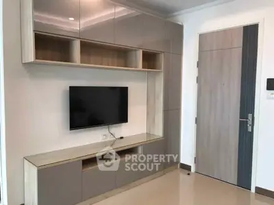 Modern living room with sleek built-in entertainment unit and mounted TV