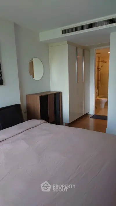 Modern bedroom with ensuite bathroom and stylish decor