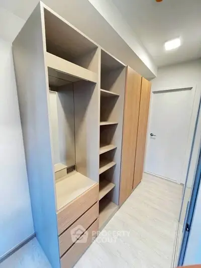 Spacious walk-in closet with modern shelving and storage solutions