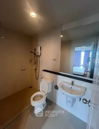 Modern bathroom with shower and toilet in a sleek apartment