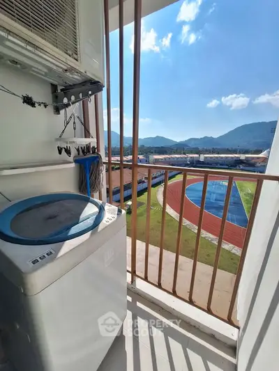 Balcony with washing machine and stunning mountain view