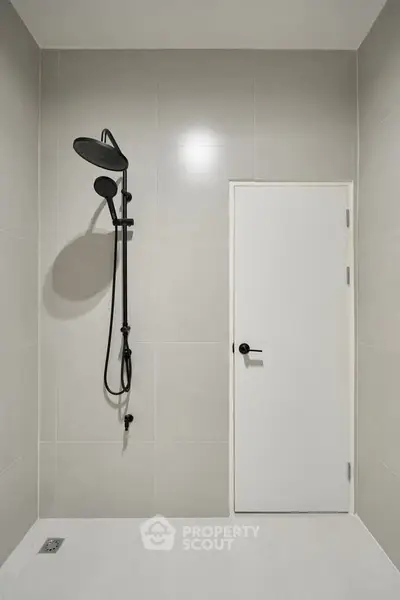 Modern minimalist bathroom with sleek shower design and neutral tiles