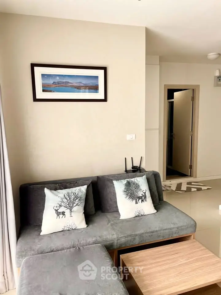 Cozy living room with stylish decor and comfortable seating in modern apartment.