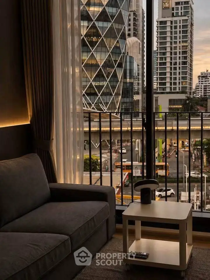 Modern living room with city view, featuring cozy sofa and stylish decor, perfect for urban living.