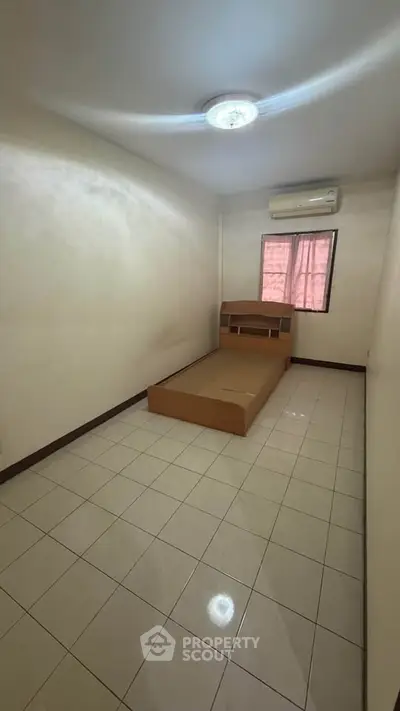 Cozy bedroom with air conditioning and minimalist design, perfect for a comfortable living space.