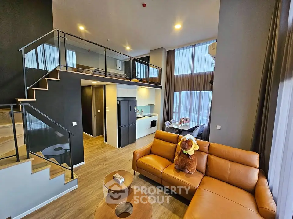 Modern duplex living room with high ceilings and stylish decor