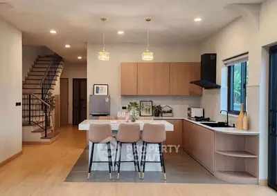 Modern kitchen with open layout and stylish island seating in a contemporary home.