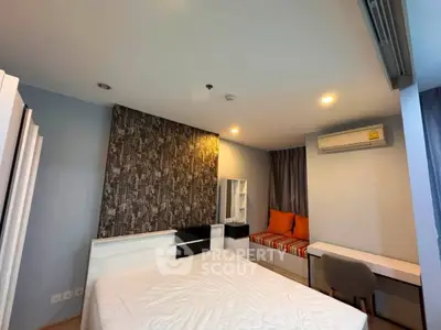 Modern bedroom with stylish decor and cozy seating area