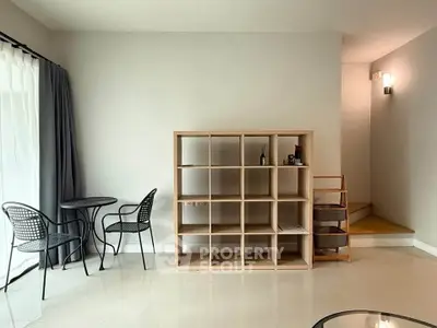 Modern living room with minimalist furniture and natural light