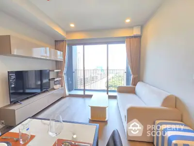 Modern living room with large window and city view, featuring cozy sofa and entertainment unit.