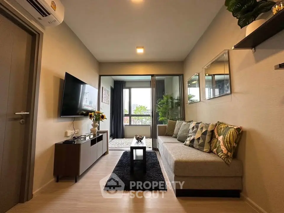Modern living room with stylish decor and balcony view