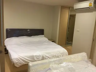 Modern bedroom with air conditioning and minimalist design in a cozy apartment.