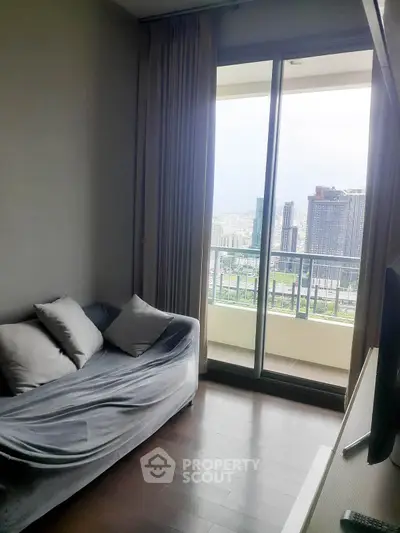 Modern living room with balcony view in high-rise apartment