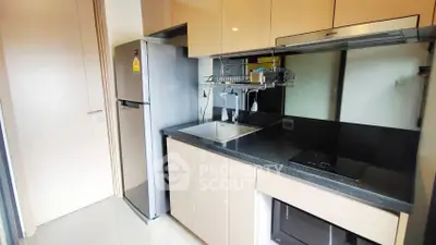Modern kitchen with sleek cabinets and stainless steel appliances
