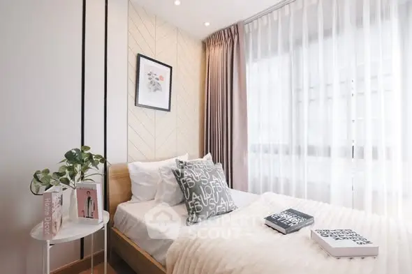 Cozy modern bedroom with natural light and stylish decor