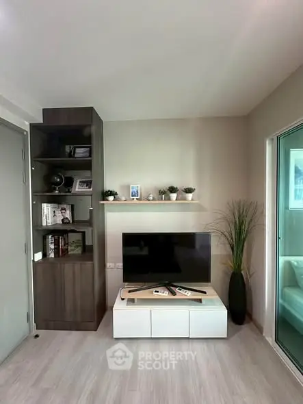 Modern living room with sleek TV setup and stylish shelving unit
