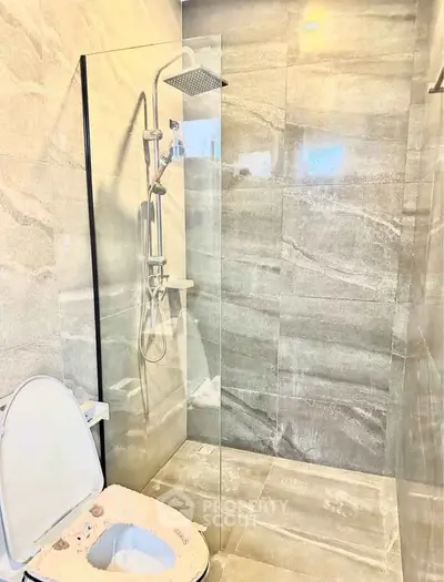 Modern bathroom with sleek shower and elegant tile design