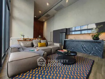 Luxurious modern living room with open kitchen and stylish decor