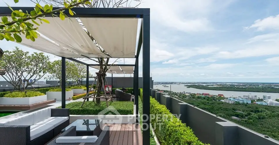 Luxurious rooftop terrace with stunning river view and modern seating area.