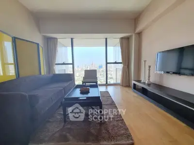 Spacious living room with stunning city view and modern furnishings