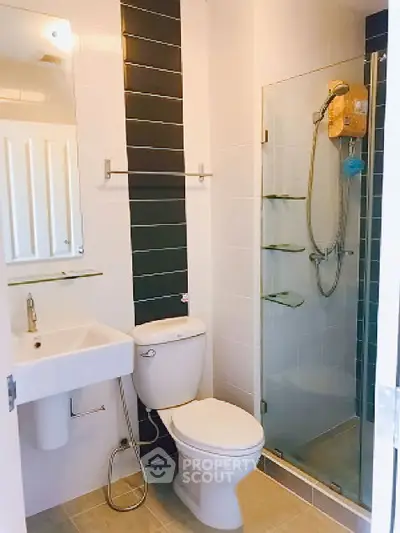 Modern bathroom with glass shower and sleek fixtures