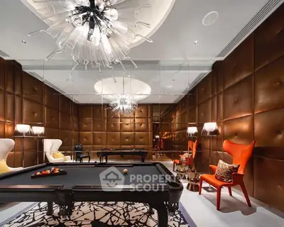 Luxurious game room with pool table and stylish lighting in modern home