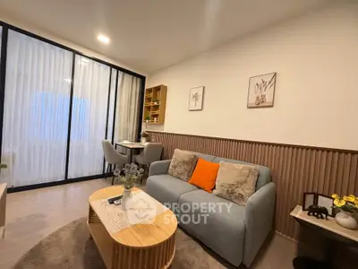 Modern living room with cozy sofa and stylish decor in a bright apartment.