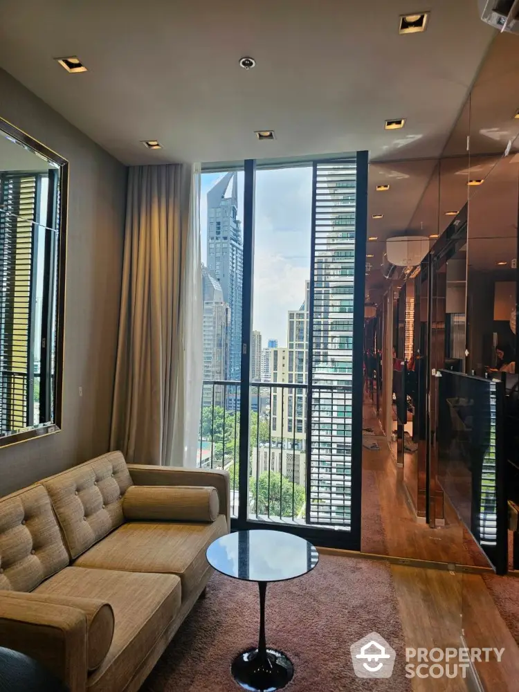 Luxurious high-rise apartment living room with stunning city view and modern furnishings.