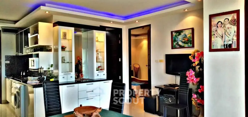 Modern open-plan living room with stylish kitchen and vibrant decor