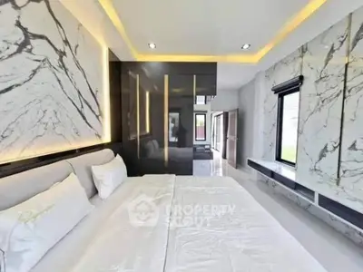 Luxurious modern bedroom with marble accents and sleek design