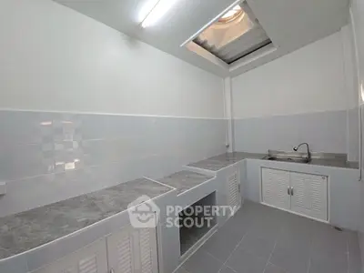 Modern kitchen with sleek countertops and ample storage space