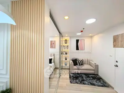 Modern living room with stylish decor and cozy seating area in a contemporary apartment.