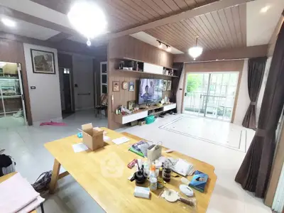 Spacious living room with modern decor and large windows for natural light.