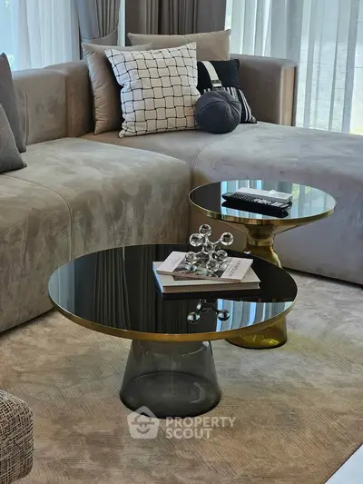 Luxurious modern living room with elegant coffee tables and plush sofa