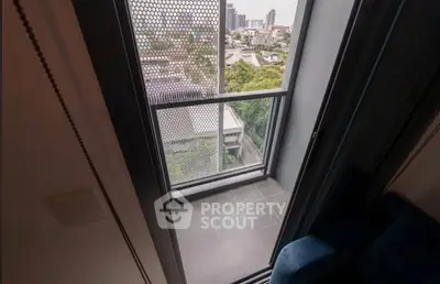 Modern apartment balcony with city view and sleek design