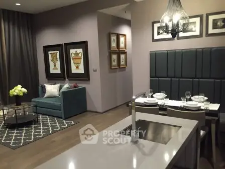 Modern open-plan living and dining area with stylish decor and elegant lighting.